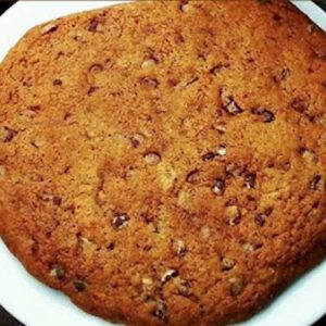 Chocolate Chip Cookie, a classic treat with a golden-brown, crispy edge and a soft, chewy center, loaded with gooey chocolate chips in every bite.