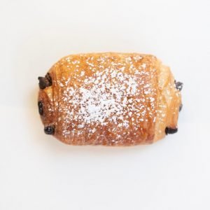 Chocolate Croissant, a golden, flaky pastry filled with smooth, rich chocolate, offering the perfect balance of buttery layers and sweet, melt-in-your-mouth chocolate.