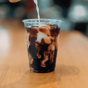 A refreshing glass of cold brew coffee, steeped slowly for a smooth, rich flavor, served over ice.