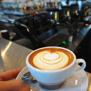A smooth cortado, with equal parts espresso and steamed milk, creating a balanced and rich flavor.