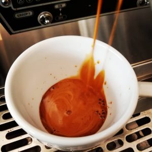 A rich shot of espresso, with a dark, velvety crema on top, offering a bold and intense coffee experience.