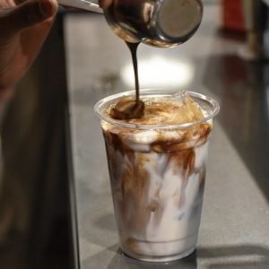 Iced caffè latte with a perfect balance of bold espresso and creamy milk, served over ice for a cool, satisfying drink.