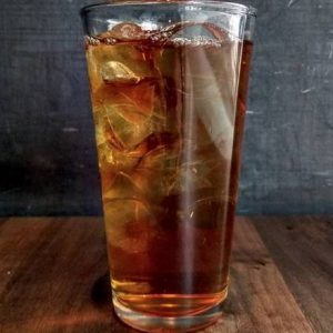 Iced Earl Grey tea served in a clear glass with ice cubes, offering a crisp, refreshing taste.