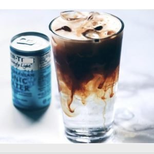 A refreshing glass of tonic espresso with craft nitro, blending the boldness of espresso with the effervescence of tonic water.